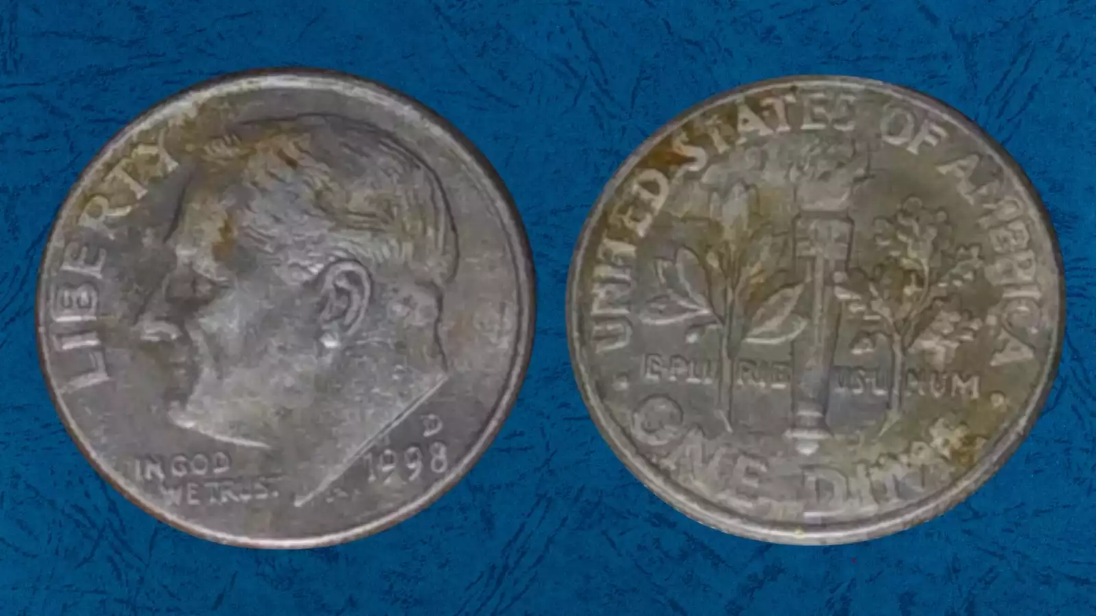 1998 Roosevelt dime missing clad layer error — one side shows copper-colored surface